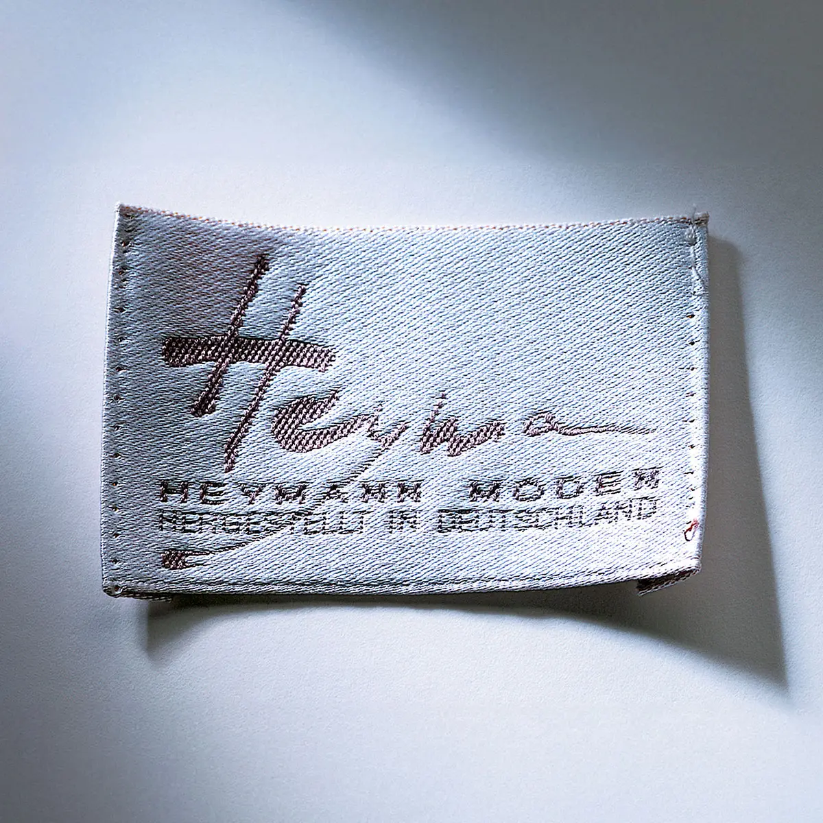Gewebtes Mode-Label »HEYMANN MODEN – Hergestellt in Deutschland«