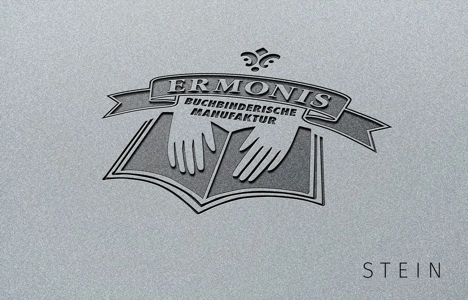 ERMONIS Logo auf Stein – Stanzung, Gravur, Prägung, Laser.